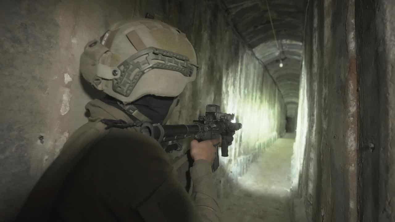 Israeli soldiers show an underground tunnel under Shifa hospital