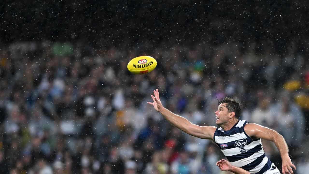 Tom Hawkins competes for the ball with Jack Scrimshaw.