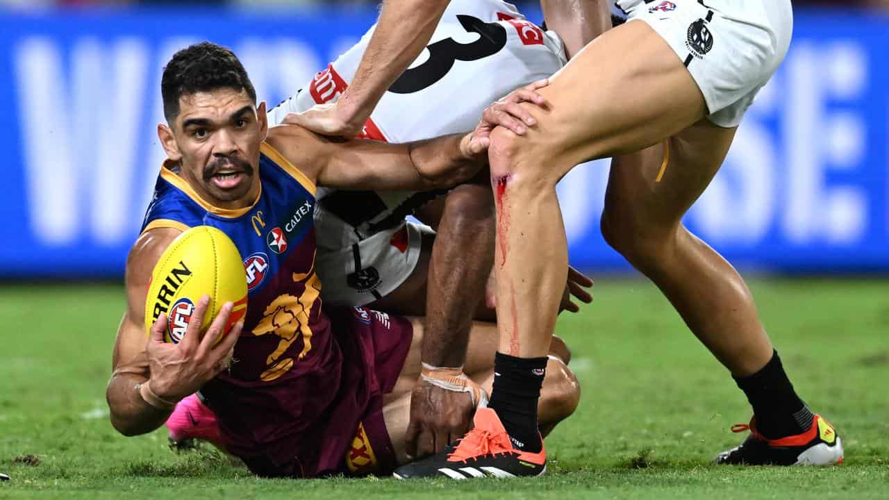 Charlie Cameron (left) against Collingwood. 