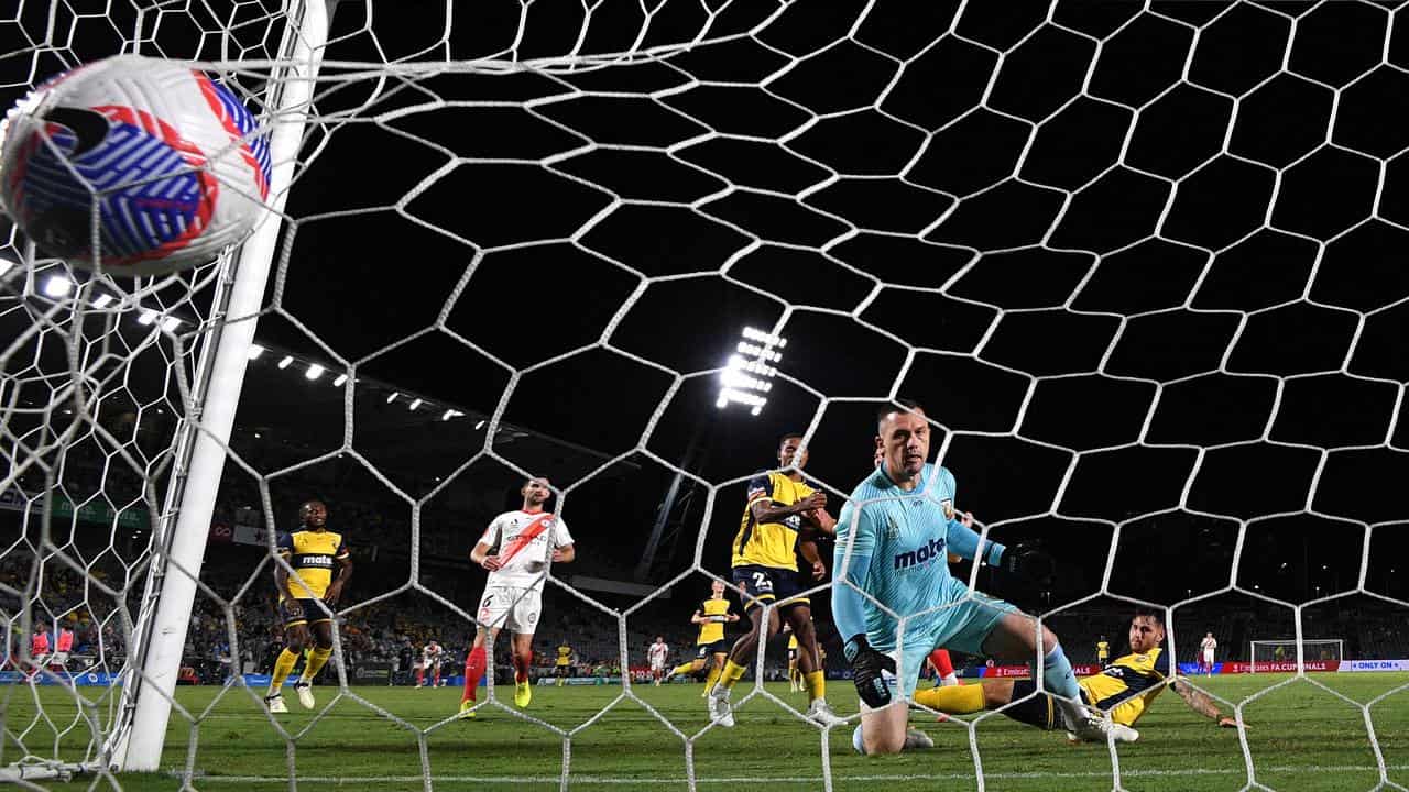 Danny Vukovic watches Tolgay Arslan's shot hit the net for City.