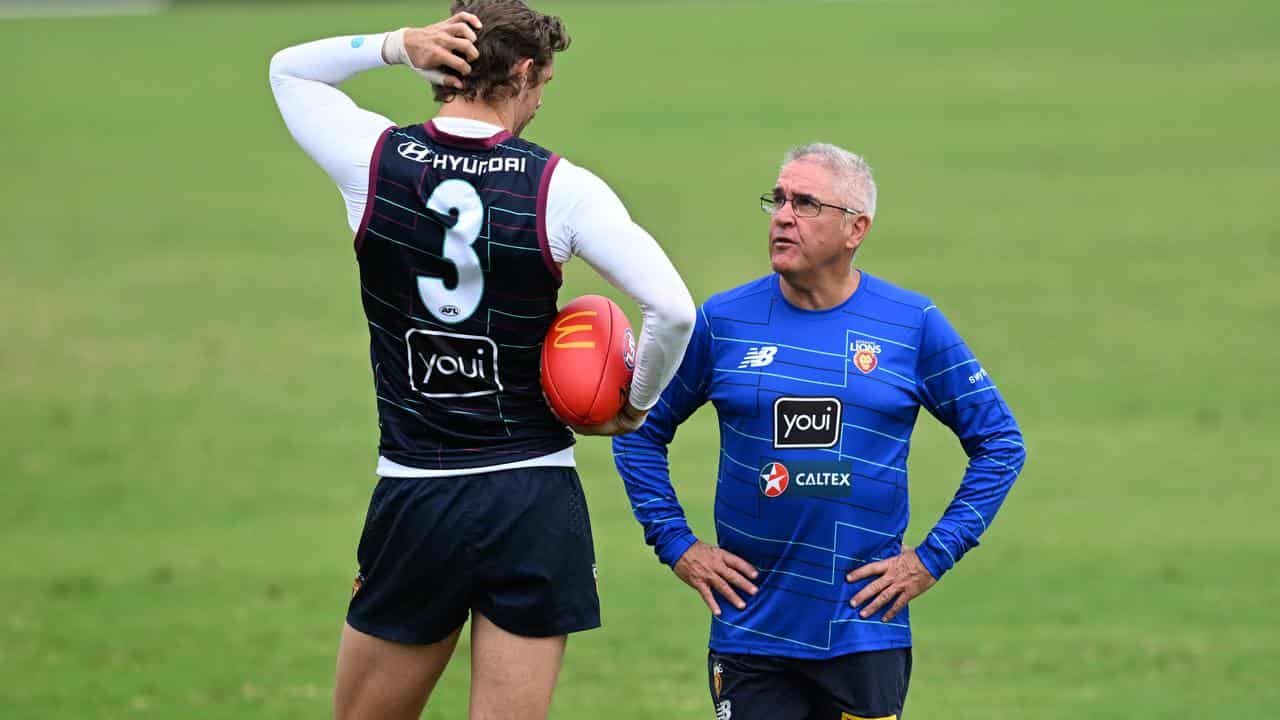 Lions coach Chris Fagan (right), with Joe Daniher