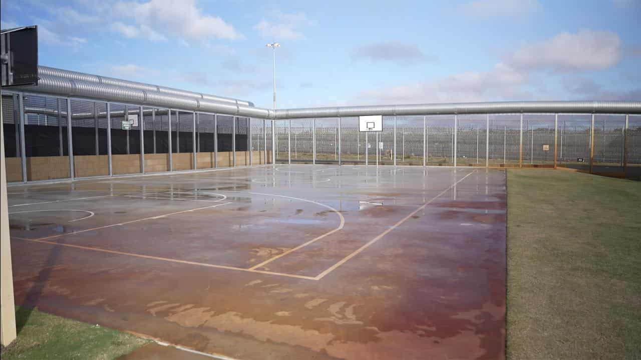 An inquest heard sea containers were placed in the basketball area.