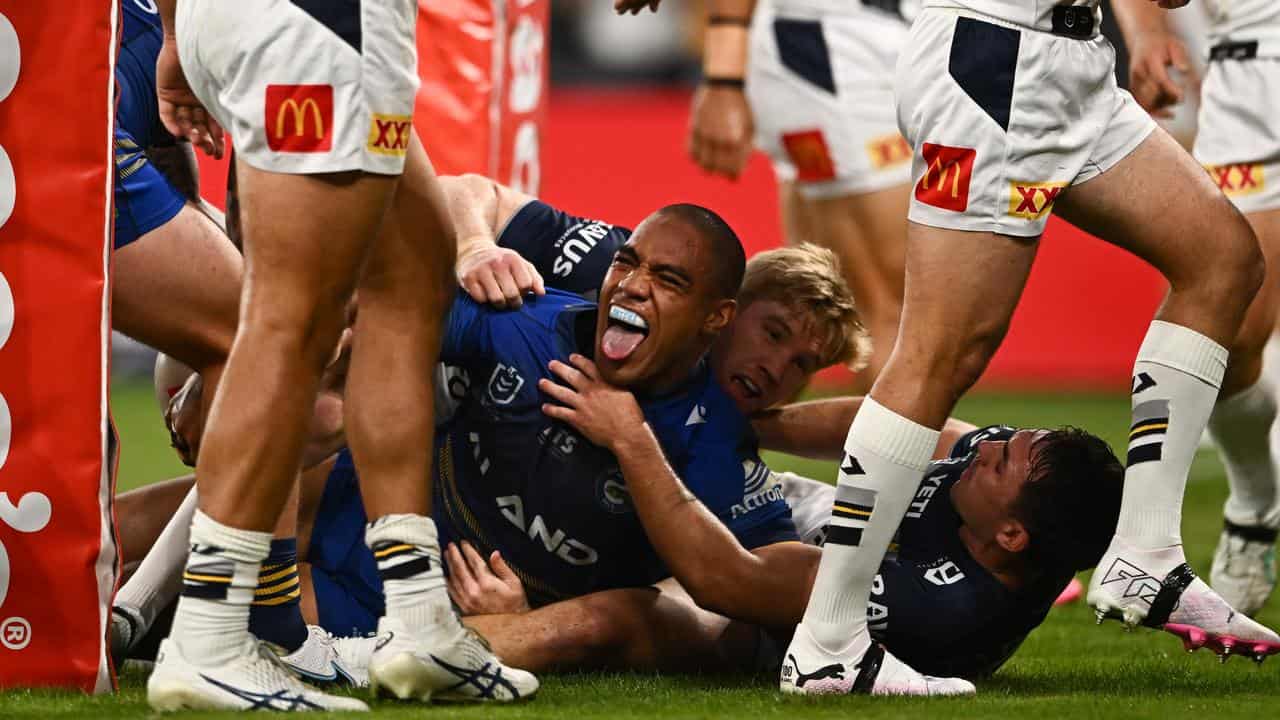 Joe Ofahengaue scores a try for the Eels. 