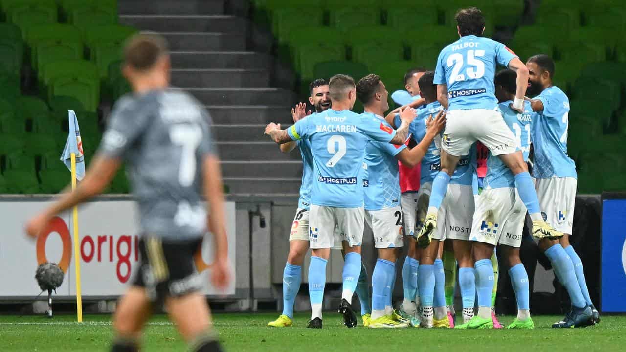 Melbourne City players celebrate against the Wanderers.