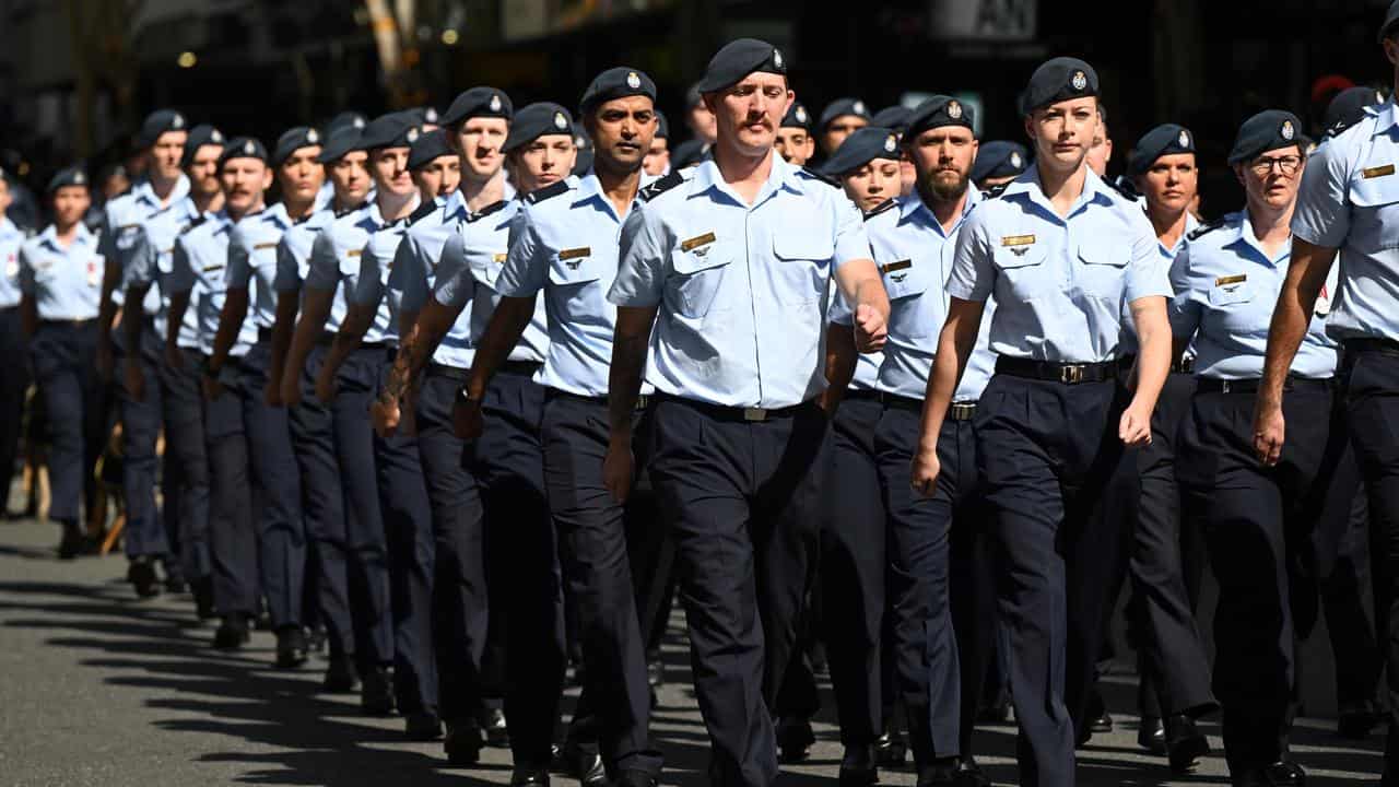 Members of the Royal Australian Air Force are seen marching