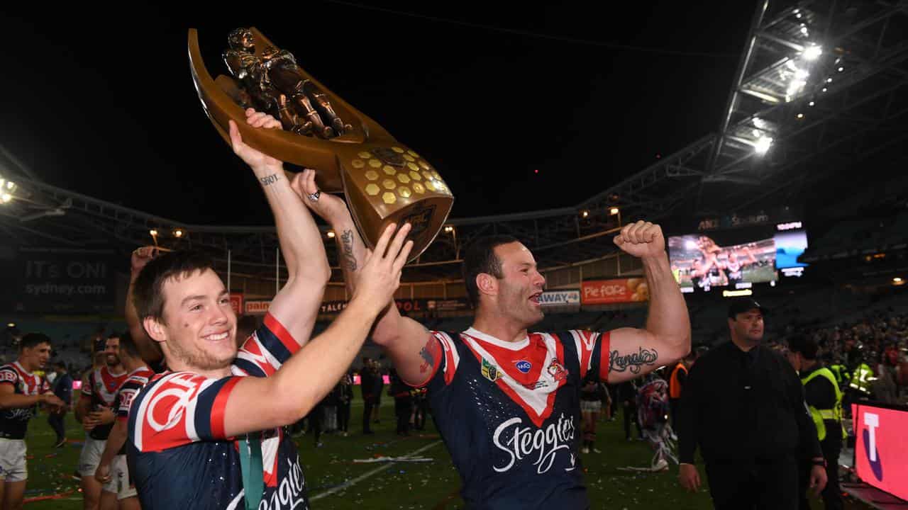 Luke Keary (left) with the 2018 grand final trophy.