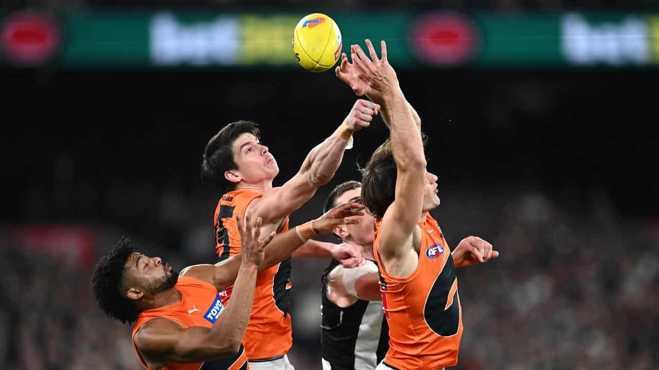 Sam Taylor rises high for the Giants. 