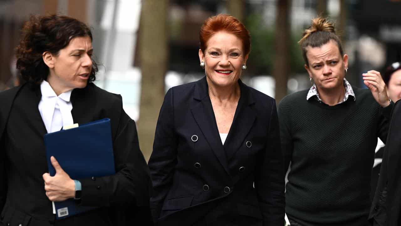 Pauline Hanson (centre) arrives at the Federal Court