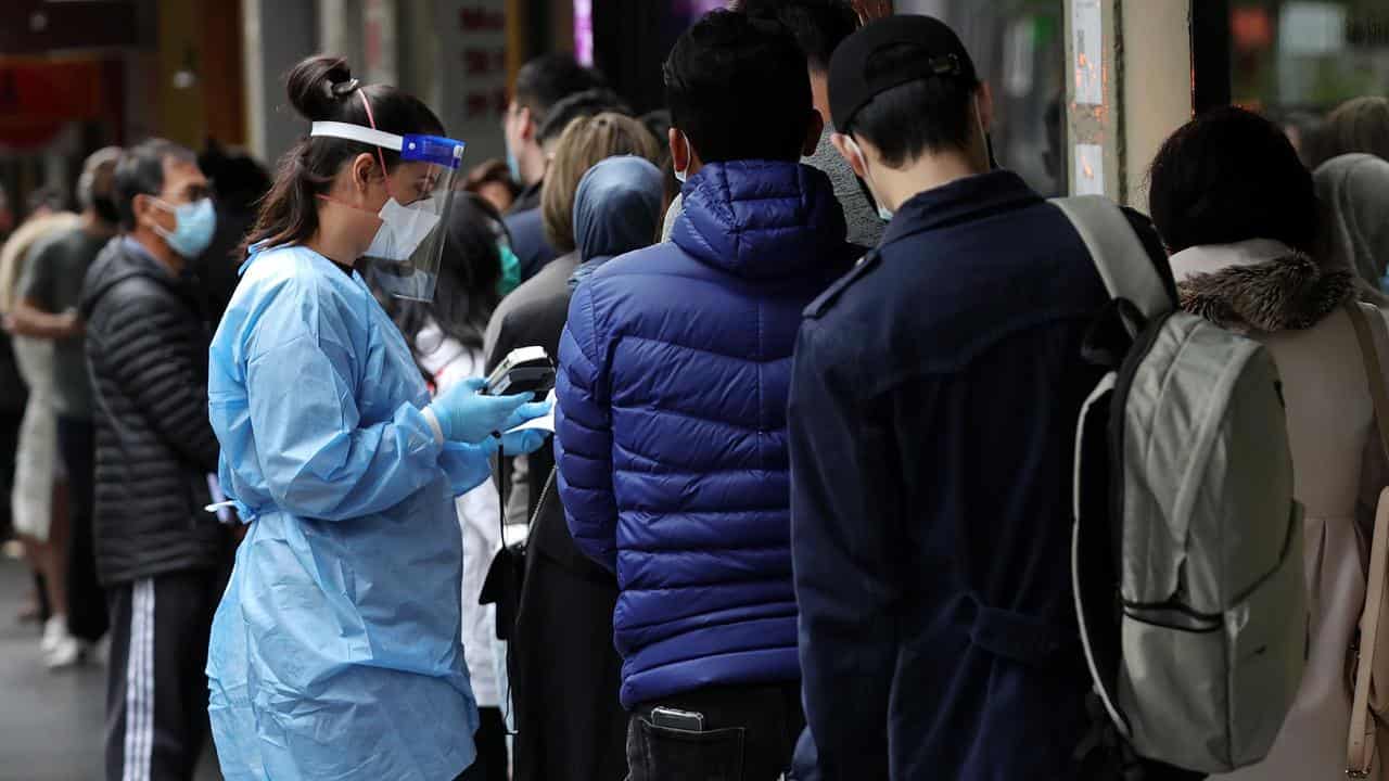 People lined up for a COVID-19 test on Russell Street in Melbourne