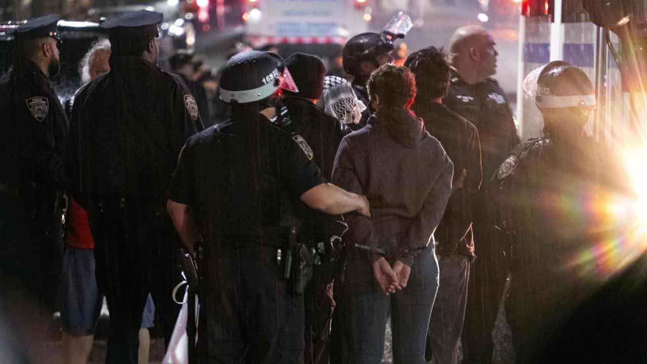 Police take people into custody near the Columbia University campus