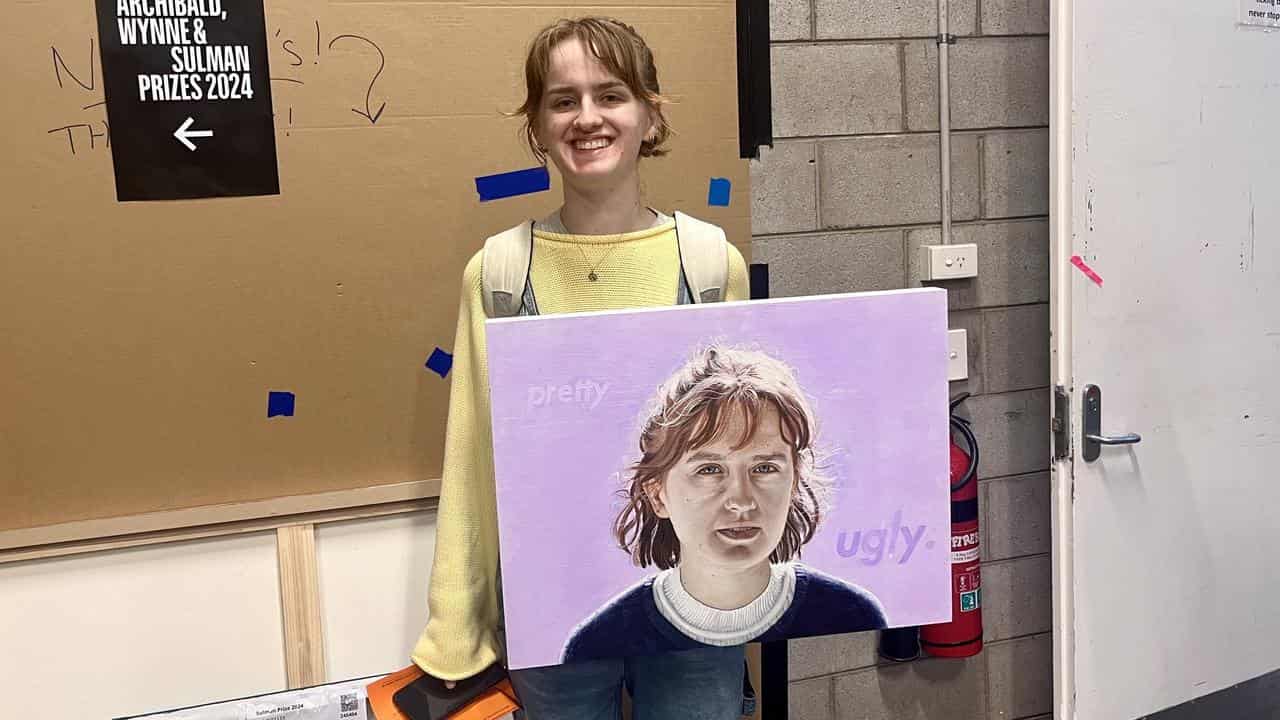 Phoebe Webb with her entry for the Archibald Prize.