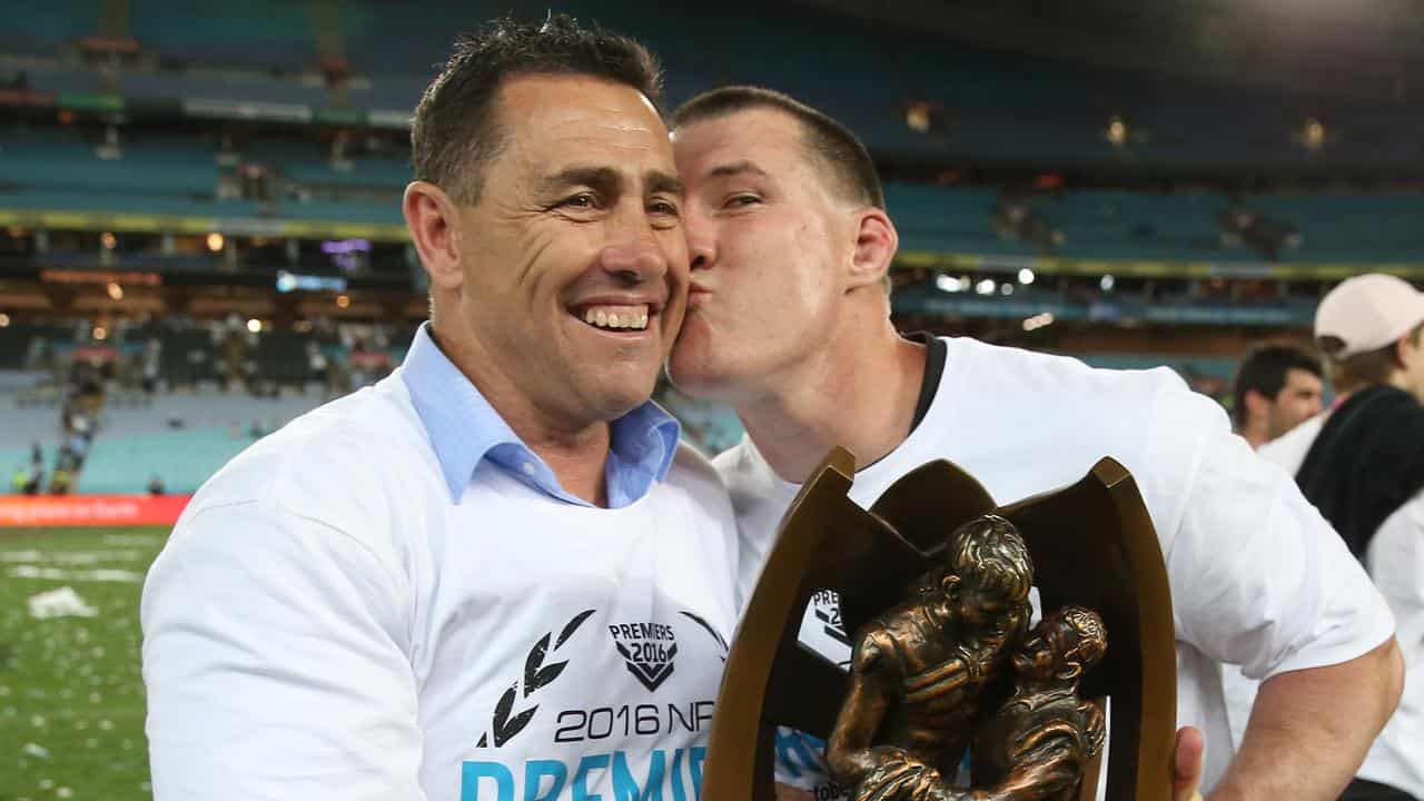 Flanagan (left) led Cronulla to 2016 grand final success.