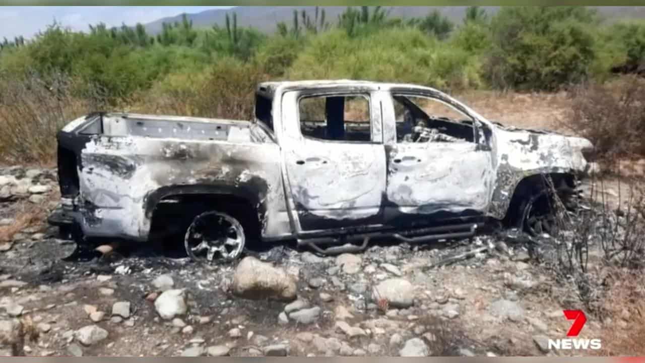 Burnt-out ute found in the search for missing Australian surfers