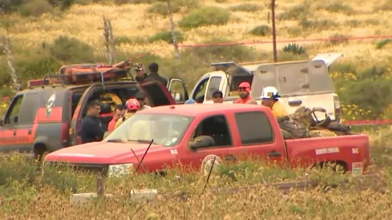 Workers at a crime scene in Ensenada