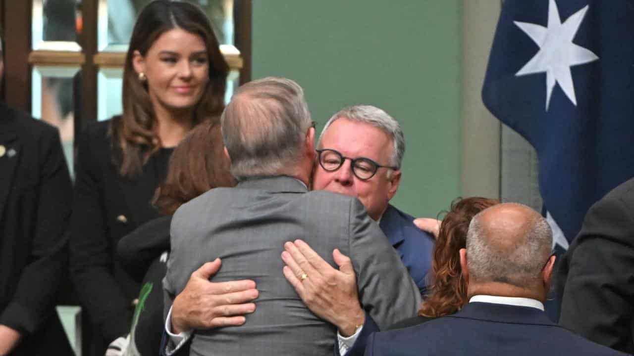 Former minister Joel Fitzgibbon is hugged by PM Anthony Albanese