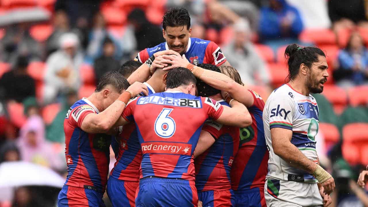 Knights players celebrate a Daniel Saifiti try.