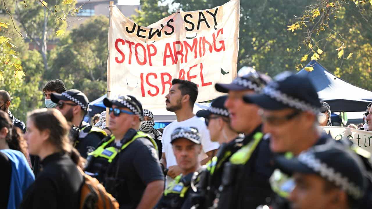 Police at a protest rally at the University of Melbourne.