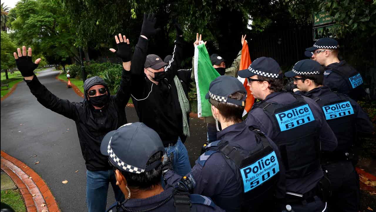 Police and protesters at Melbourne rally