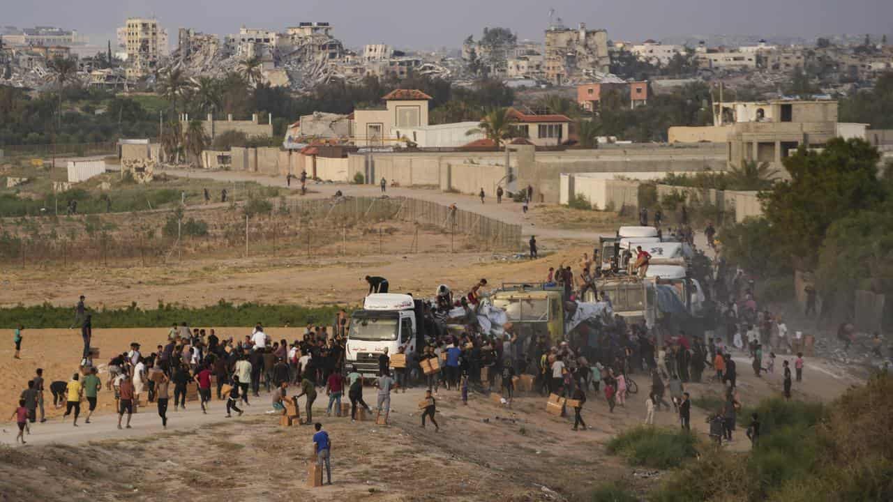 Palestinians are storming trucks