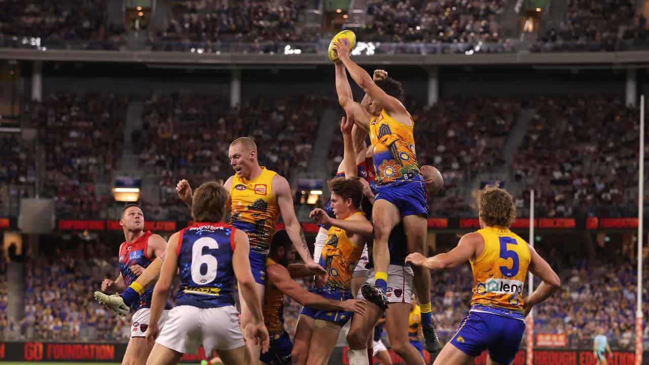 Tom Barrass leaps to take a mark.