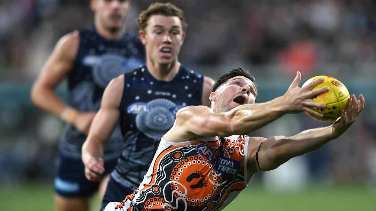 Toby Greene marks in last year's fixture at Geelong.