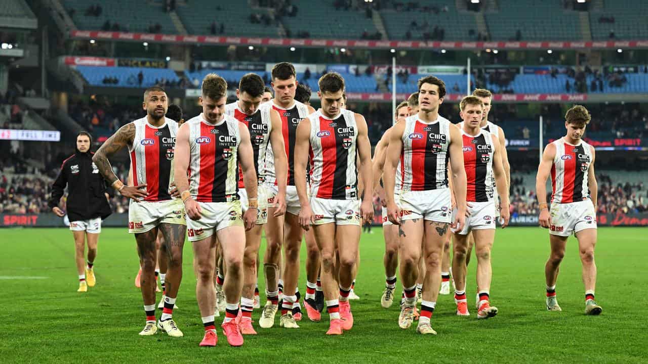 St Kilda leave the field. 