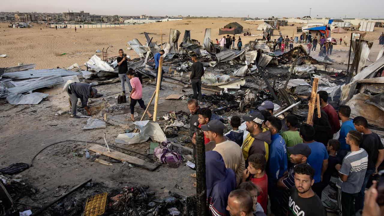 Israeli airstrikes ignited a massive blaze at a tent camp in Gaza.