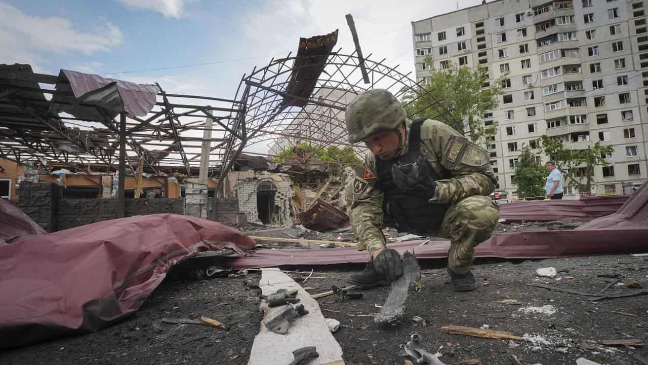 Sapper inspects fragments of a Russian bomb in Kharkiv