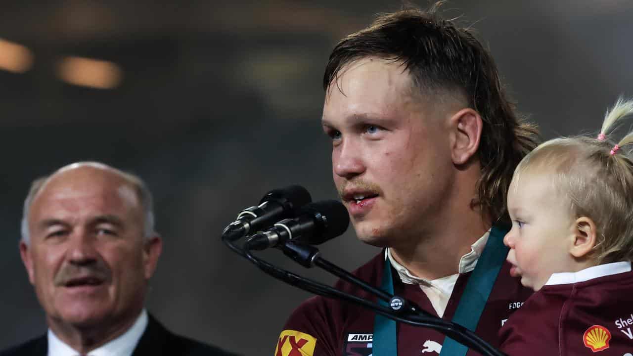 Queensland forward Reuben Cotter receives the Wally Lewis Medal.