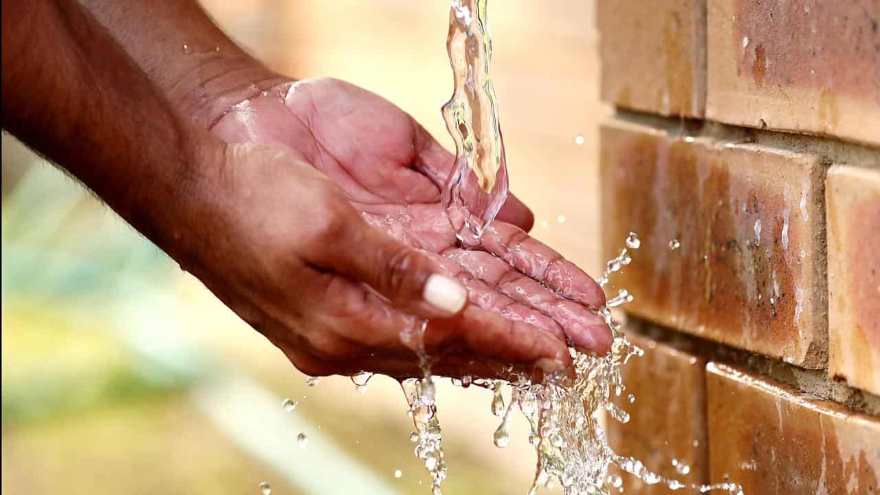 Water drips from a tap