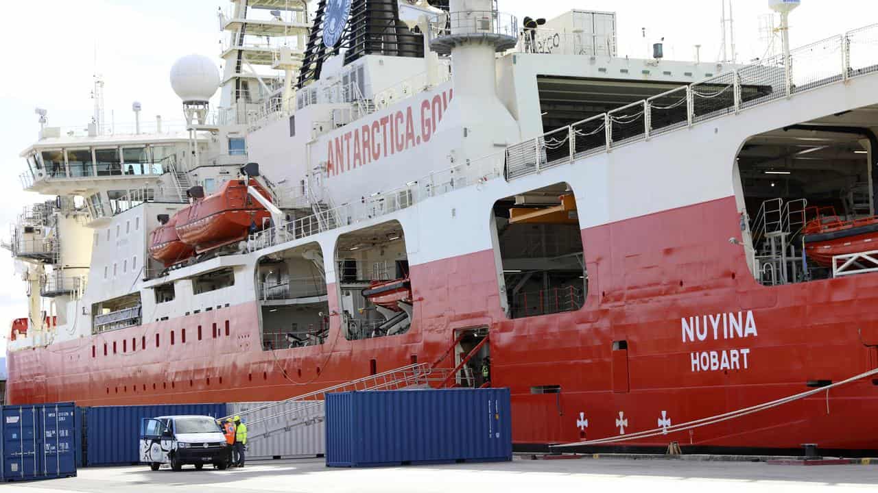 A ship docked at a berth.