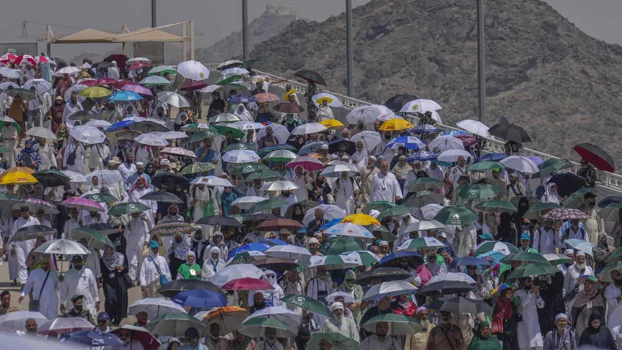 Pilgrims shelter from the sun near Mecca.