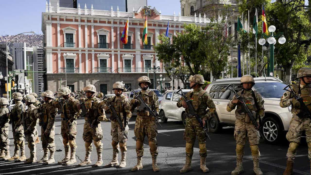 Soldiers stand guard outside the Bolivia's presidential palace