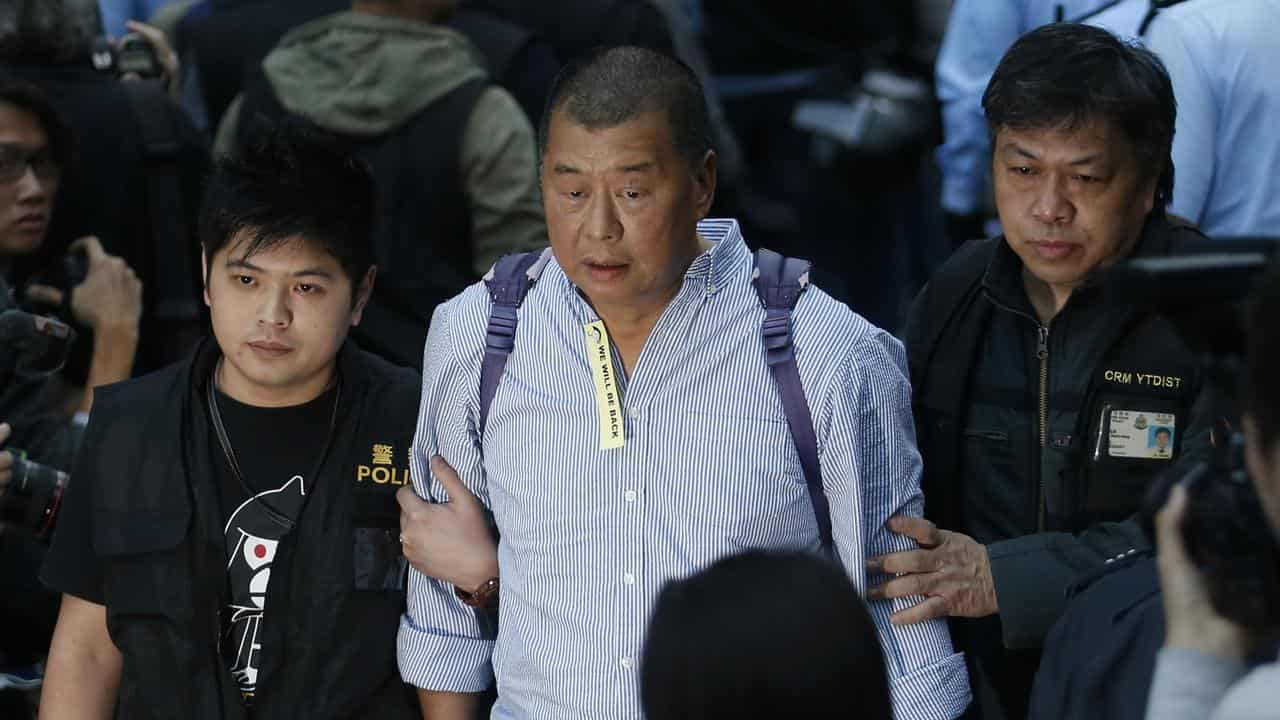 Hong Kong media magnate Jimmy Lai is taken away by police