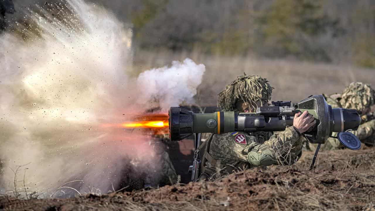 A Ukrainian serviceman fires an NLAW anti-tank weapon