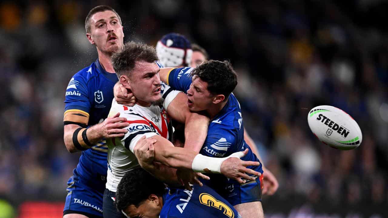 Angus Crichton (centre) of the Sydney Roosters.