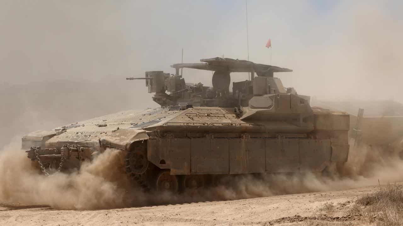 An Israeli armoured personnel carrier near the border with Gaza 