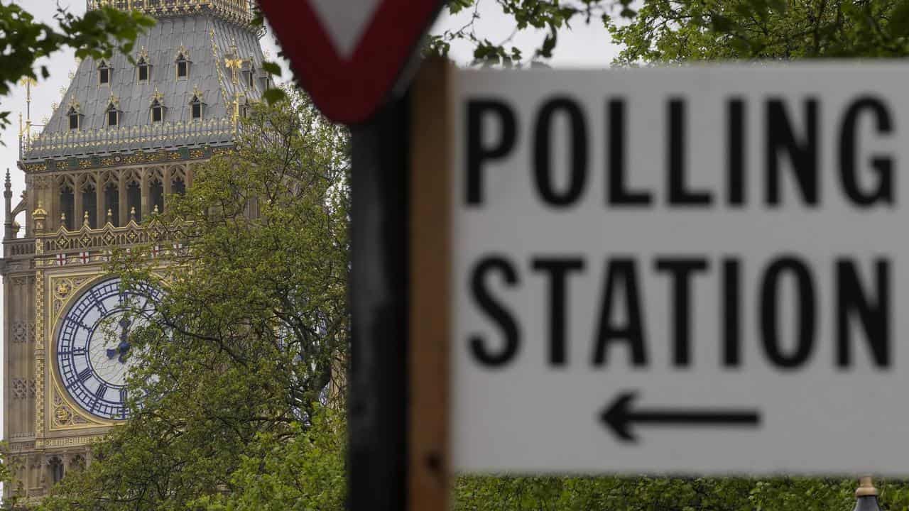 A sign points to where residents can cast their votes in London