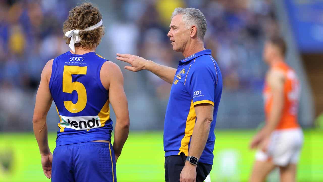 Jayden Hunt (left) and coach Adam Simpson (right).