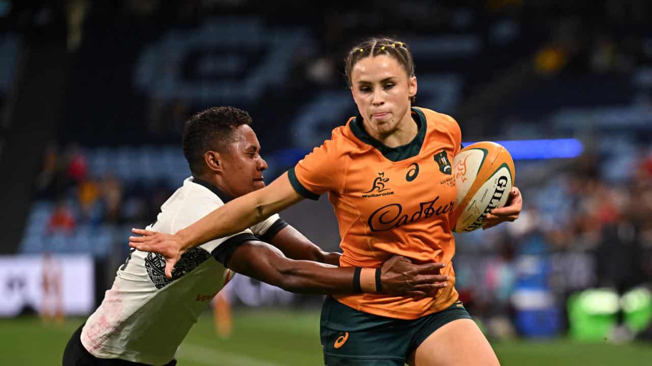 Desiree Miller power down the wing for the Wallaroos v Fiji.