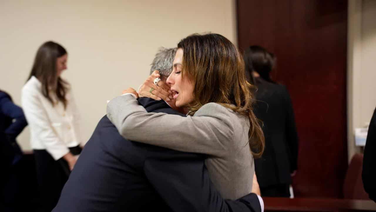 Alec Baldwin hugging his wife Hilaria, after the court ruling