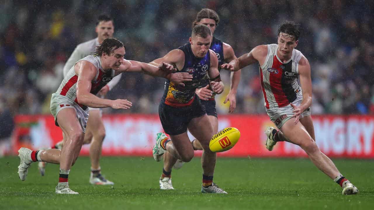 Adelaide's Rory Laird (centre).