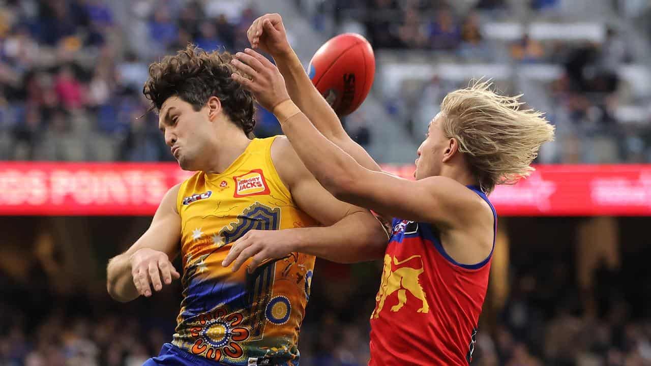 West Coast's Tom Barrass (left) and  Brisbane's Kai Lohmann.