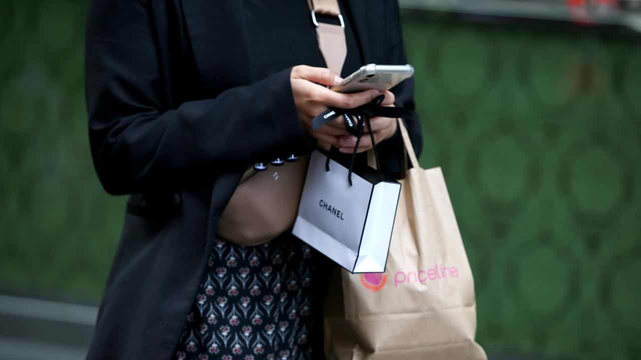 A person holding shopping bags