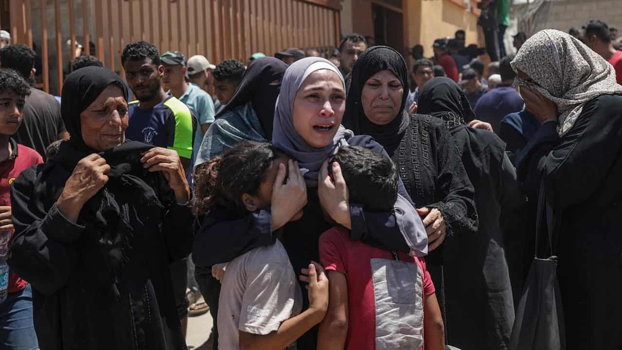 A woman mourns after an Israeli air strike in the Al-Mawasi area