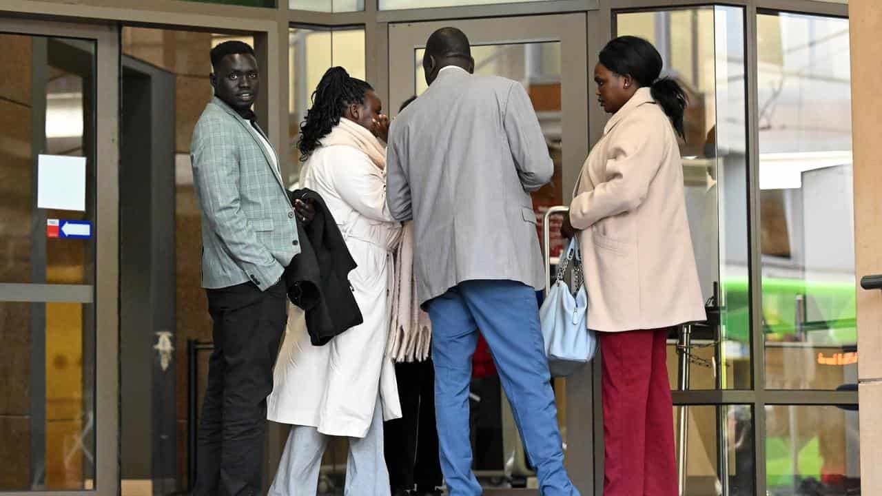 Supporters of Atem Akoi Thon depart the court