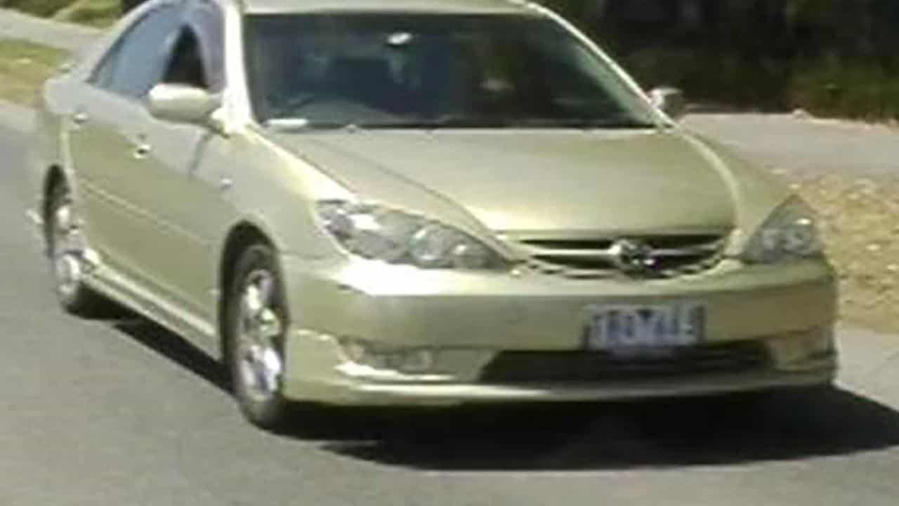 Adrian Romeo's gold sedan