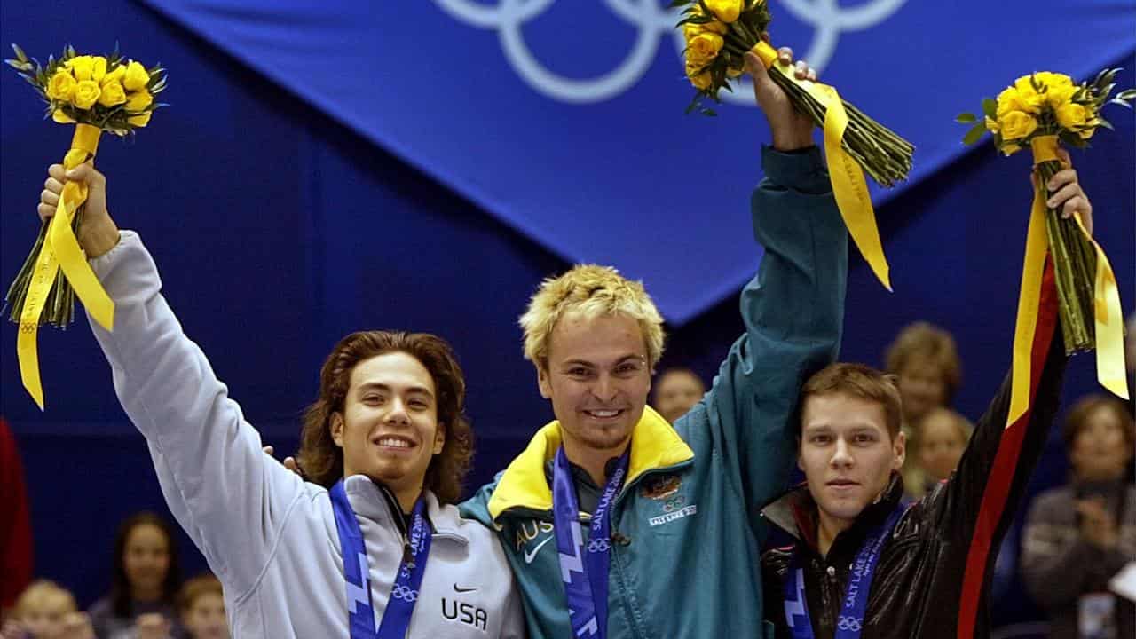 Three Olympians on a podium.