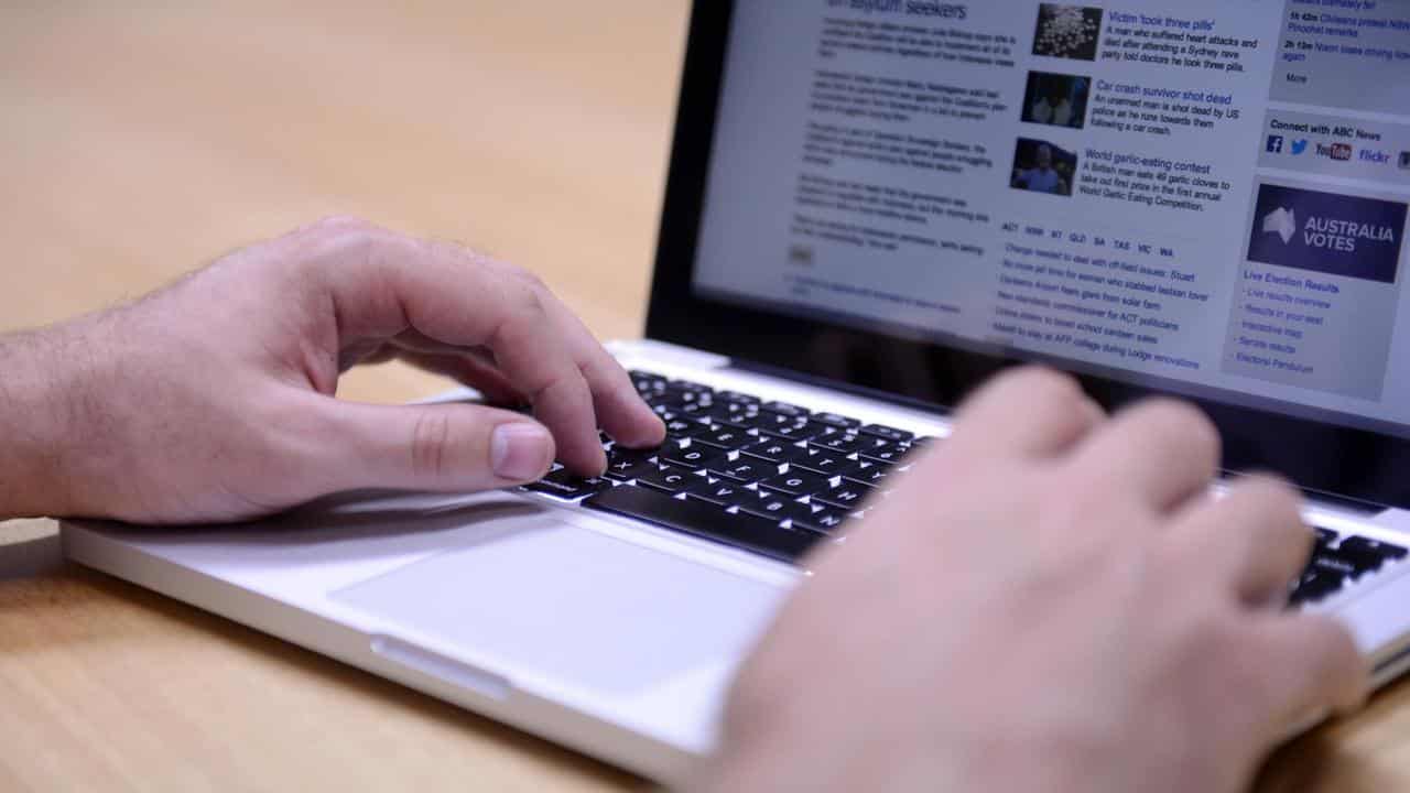 Man uses laptop computer