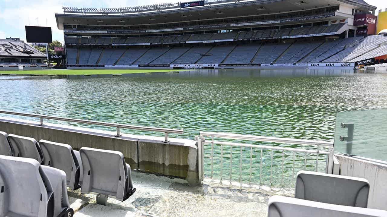 An image shows a flooded Eden Park in Auckland.